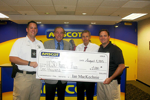 Ian MacKechnie presents check to HCSO