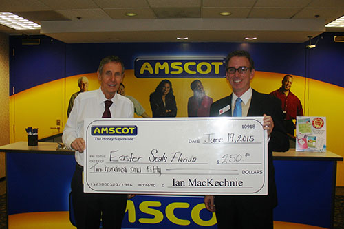 Ian MacKechnie presents donation to Easter Seals